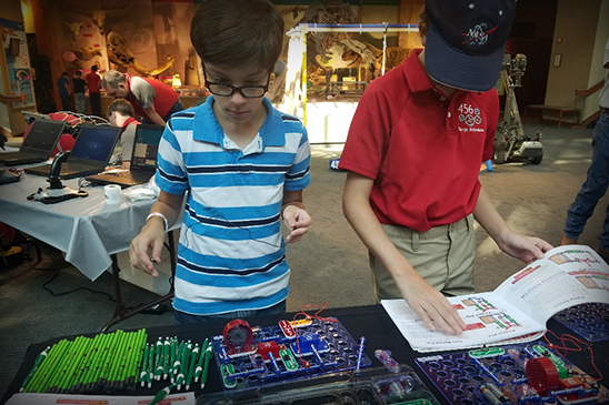 Students stop by the Entergy booth at the Mississippi Science Fest.